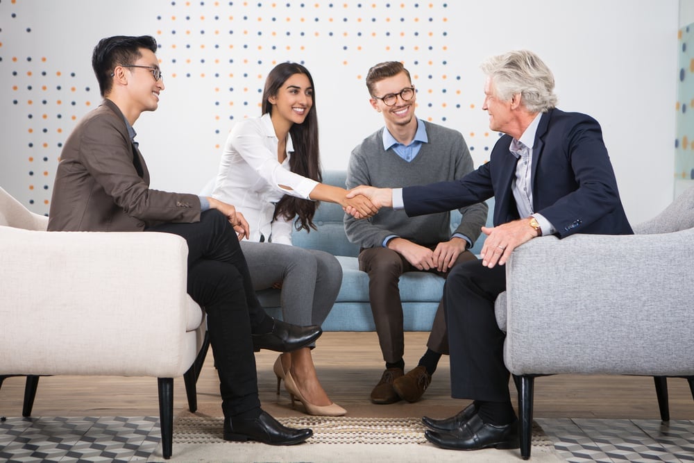 Young,And,Senior,Business,People,Shaking,Hands shutterstock 540133216