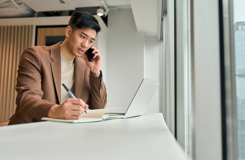 Busy,Asian,Young,Business,Man,Sales,Manager,Making,Phone,Call shutterstock 2312398583