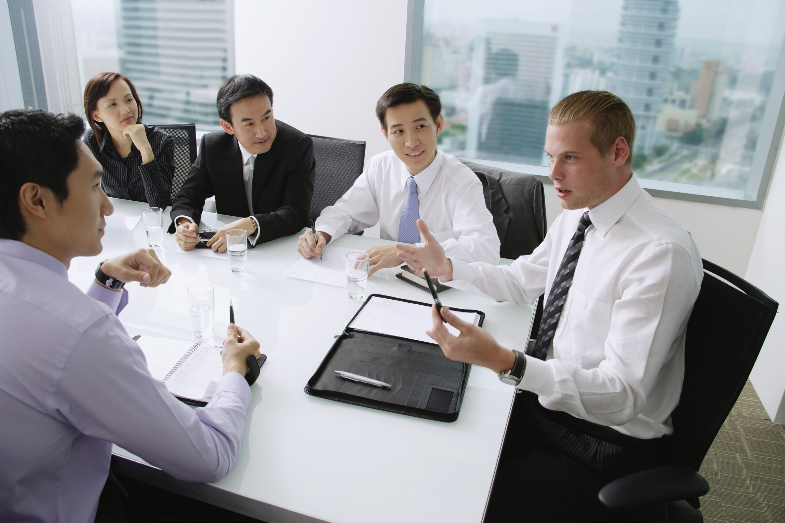 Executives,Having,A,Discussion,Around,Conference,Table,,Caucasian,Man,At shutterstock 585911201 scaled